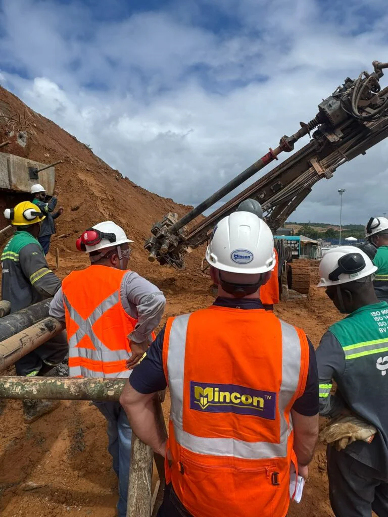 Mincon team members alongside a drilling operation in South America